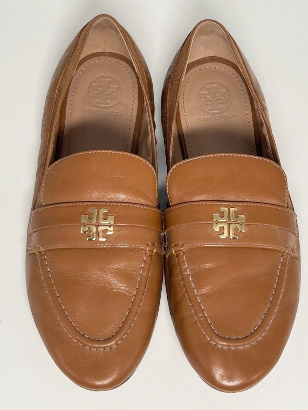 Tory Burch Eleanor Loafer in a caramel brown leather finish. US 7